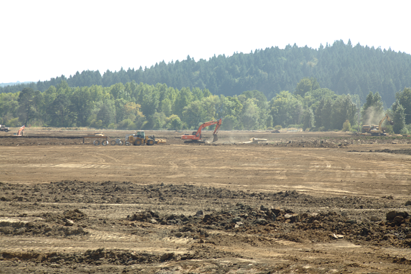 Pondscape with backhoe