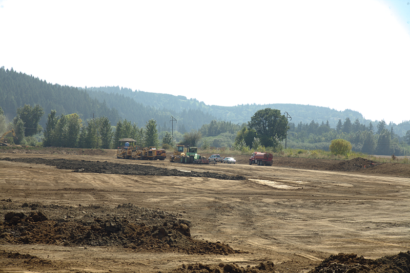 Pondscape with bulldozers