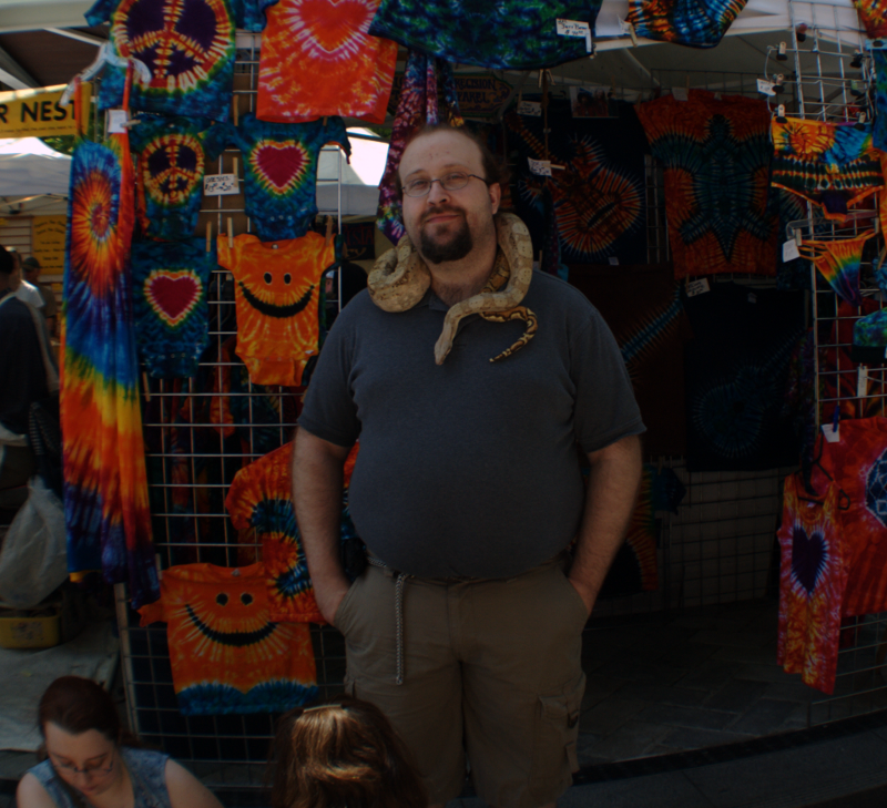 man with snake at Saturday Market